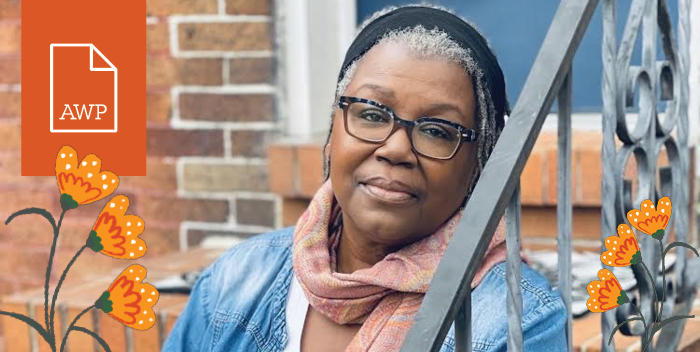HBCU Creative Instructor A.J. Verdelle wearing a black headband and pink scarf